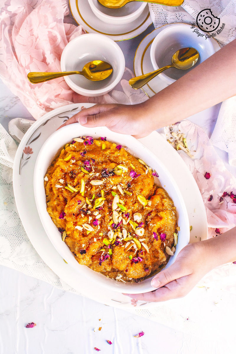 mango halwa topped with nuts and dried rose leaves