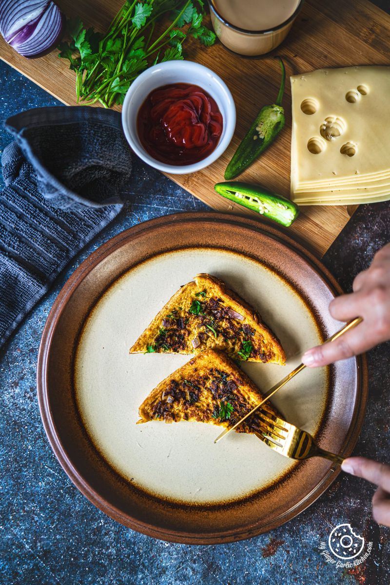 overhead shot of masala french toast in clay plate