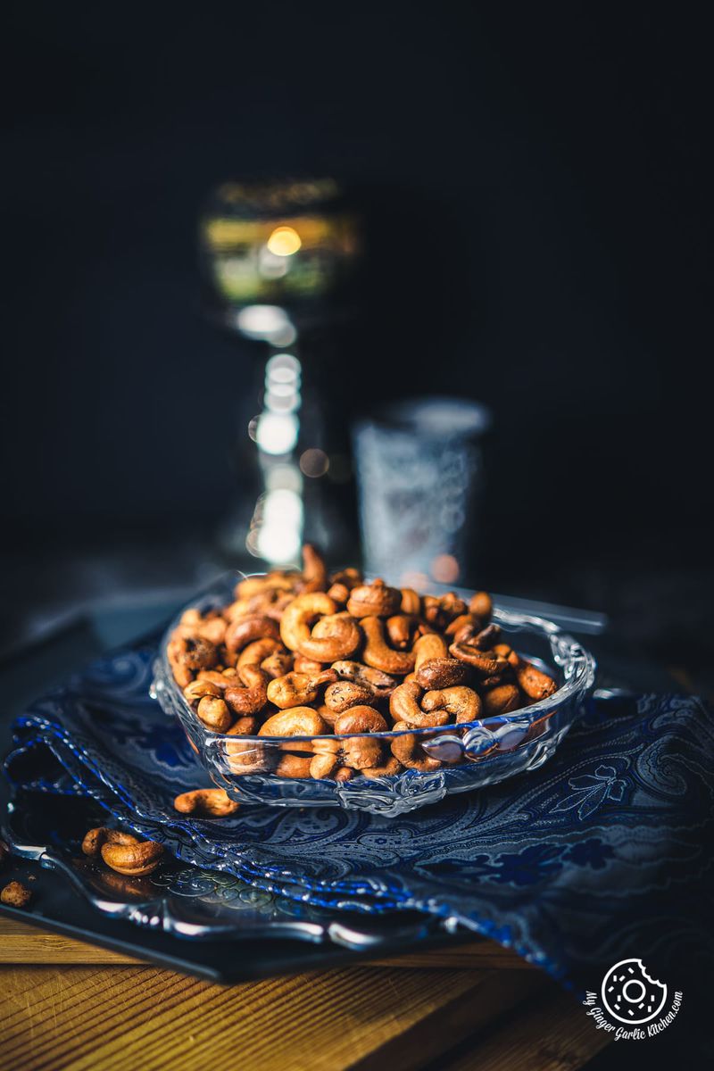 masala kaju (spicy roasted cashew nuts) served in a heart shape transparent bowl
