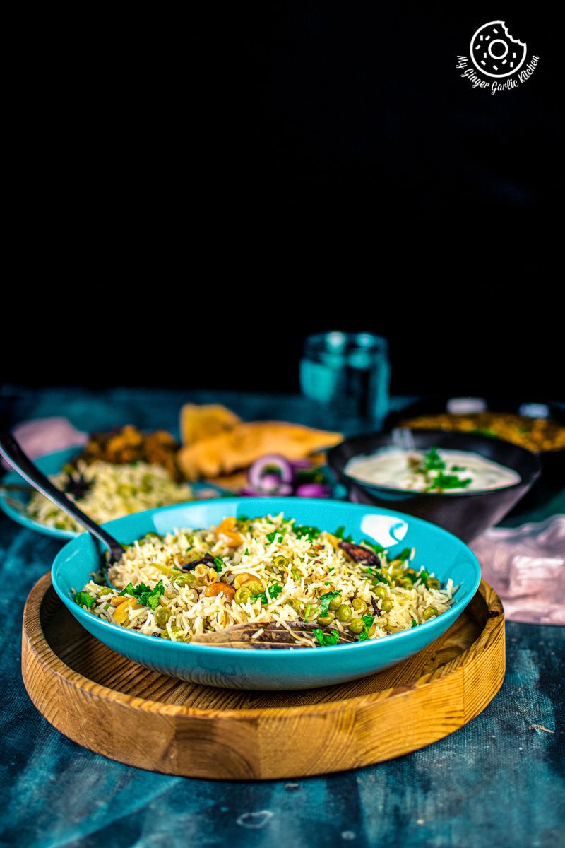 matar pulao served in a light blue plate