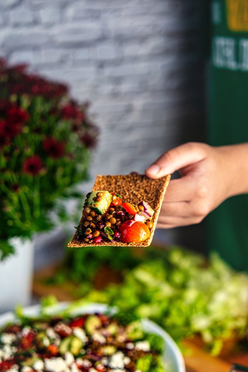 Lentil salad with pomegranate, feta, cucumber, tomatoes, red pepper, and romaine lettuce