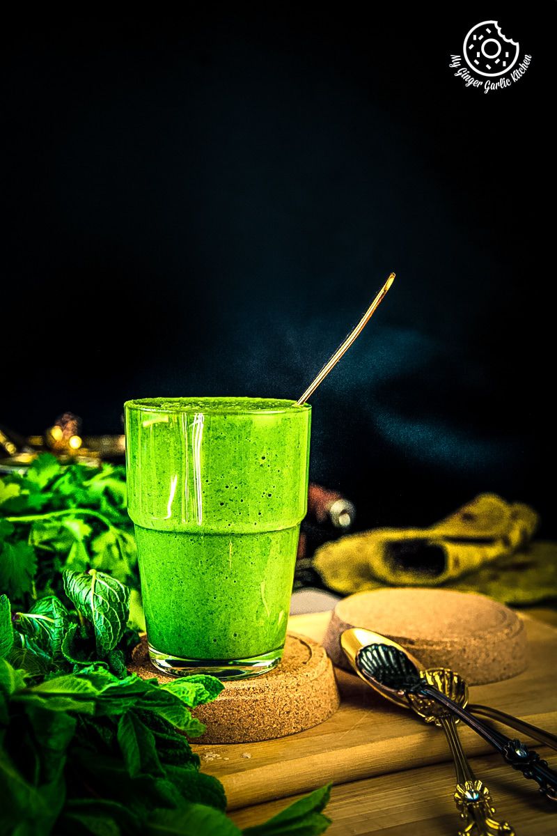 green mint coriander chutney served in a glass jar