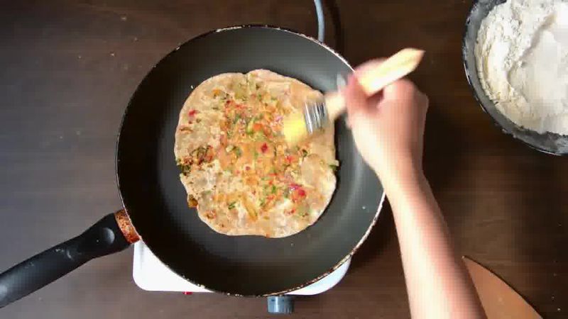 Image of the recipe cooking step-4-6 for Mooli Paratha With Strawberry Grapes Chutney (Video)