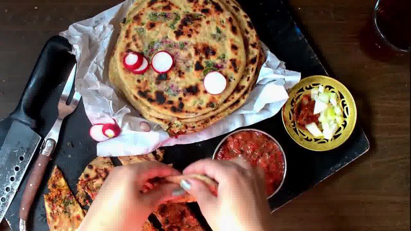 Image of the recipe cooking step-4-7 for Mooli Paratha With Strawberry Grapes Chutney (Video)
