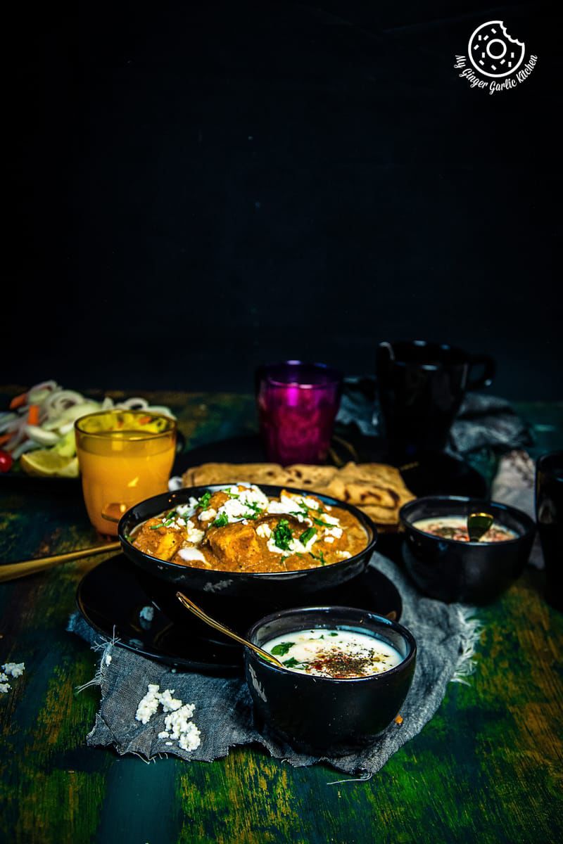 panner lababdar curry served in a black bowl