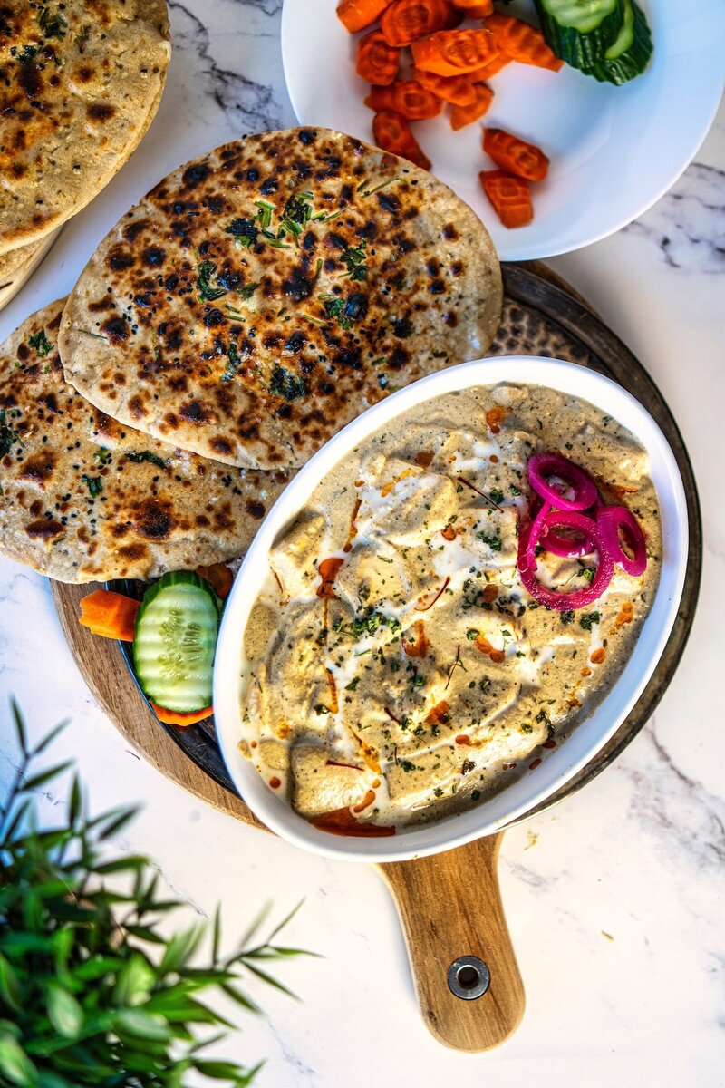 Paneer nawabi white gravy curry served with naan and salad, creamy paneer curry without tomato restaurant style