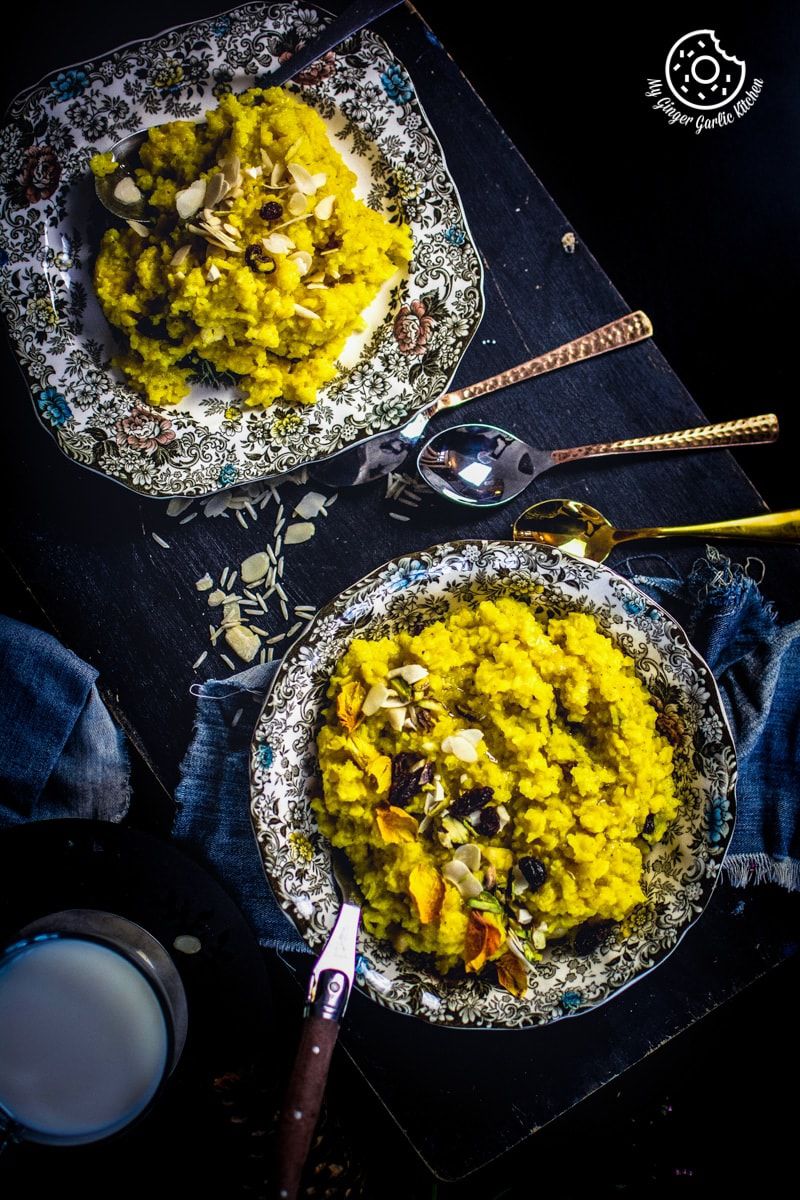 two plates of jaipuri paush khichda or sweet dal khichdi on a table with a spoon