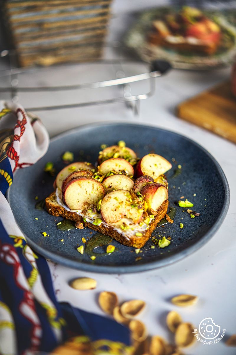 there is a plate of peach toast on a table with a napkin