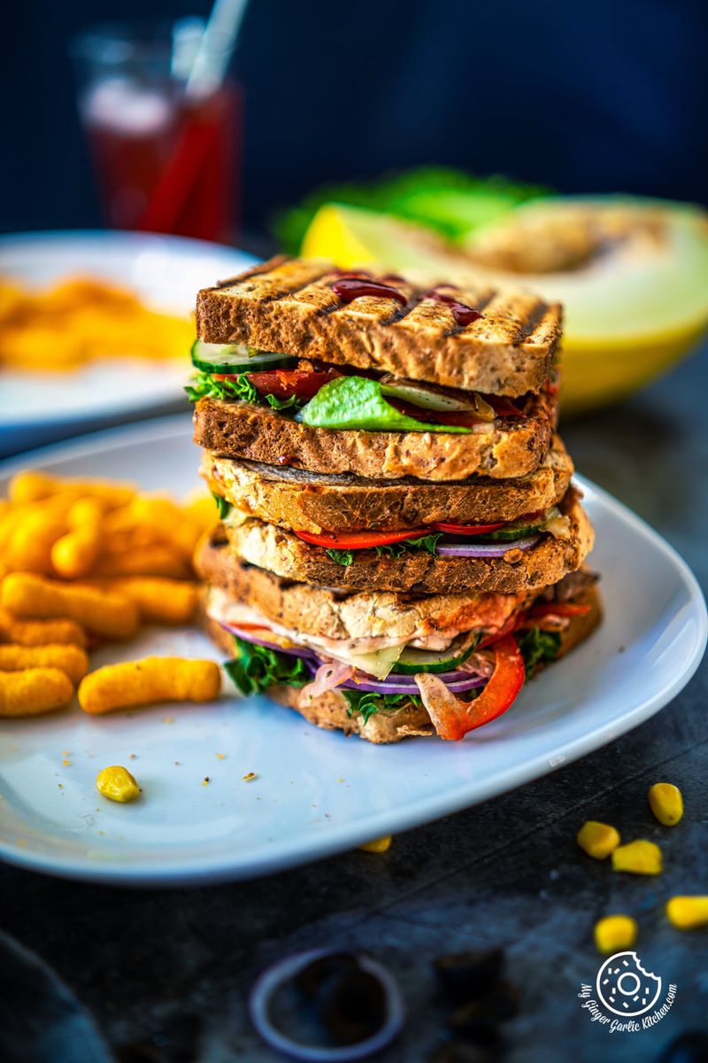 a stack of peanut butter and veggie grilled cheese sandwiches