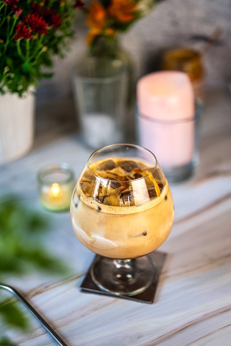 Peanut butter iced latte with creamy coffee and ice served in a glass