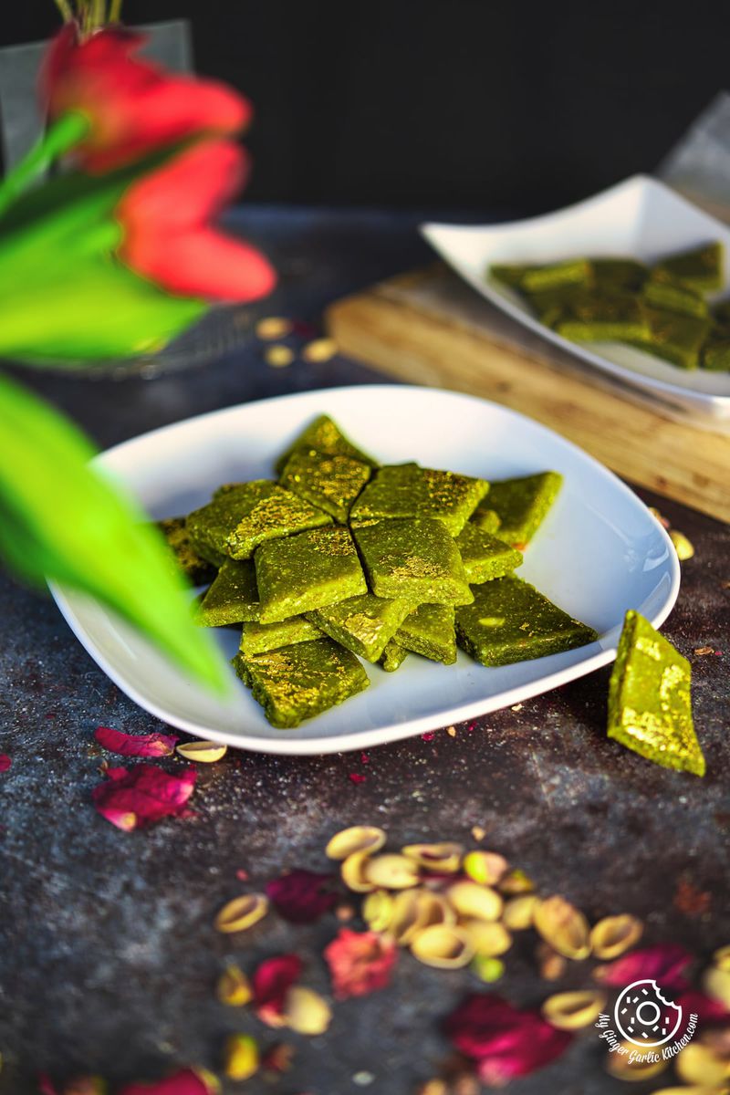 a stack of pista katli arranged on a white plate