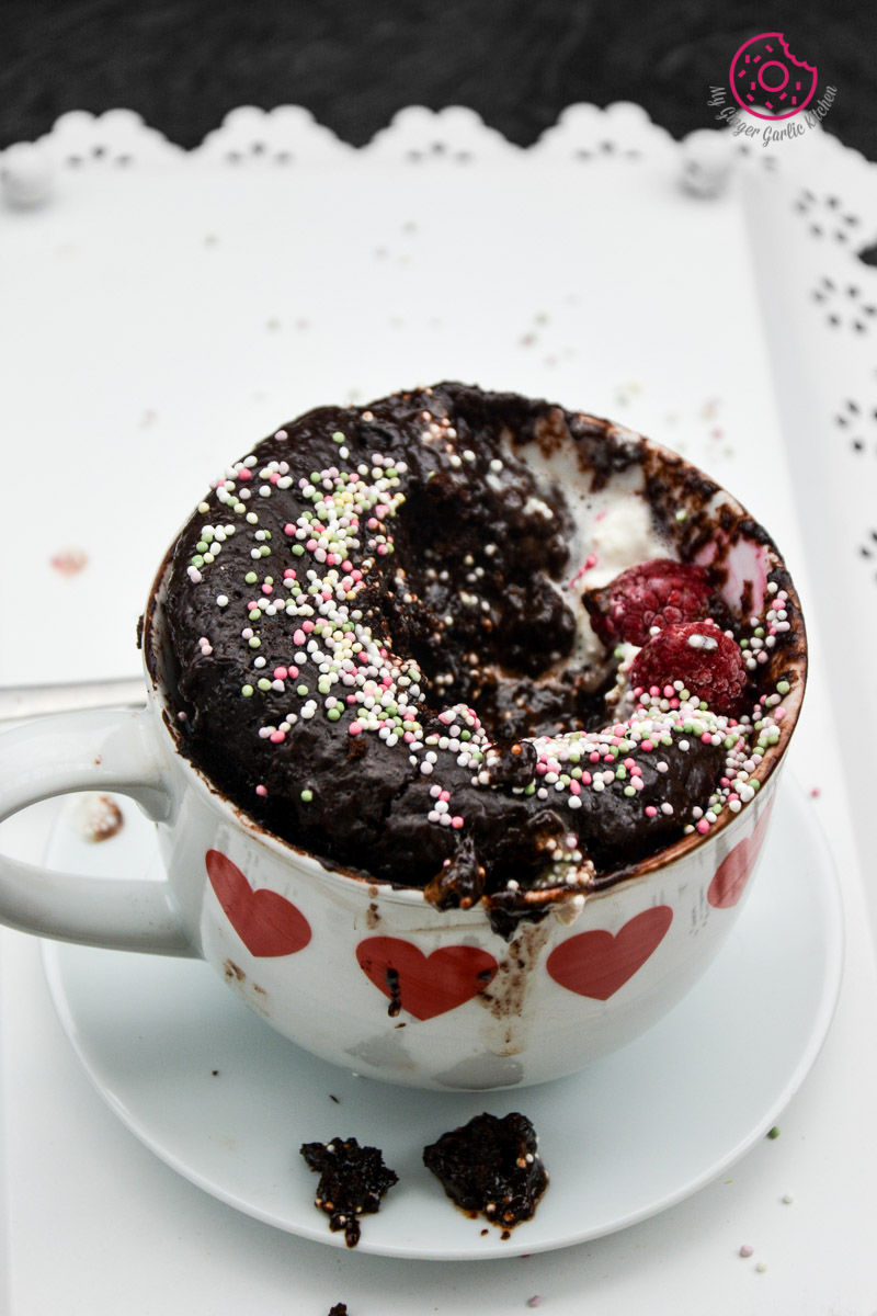 a cup of chocolate molten lava mug cake with sprinkles on it