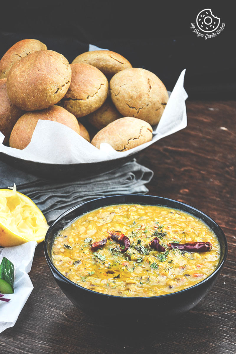 bowl of dal and a bowl of bati on a table