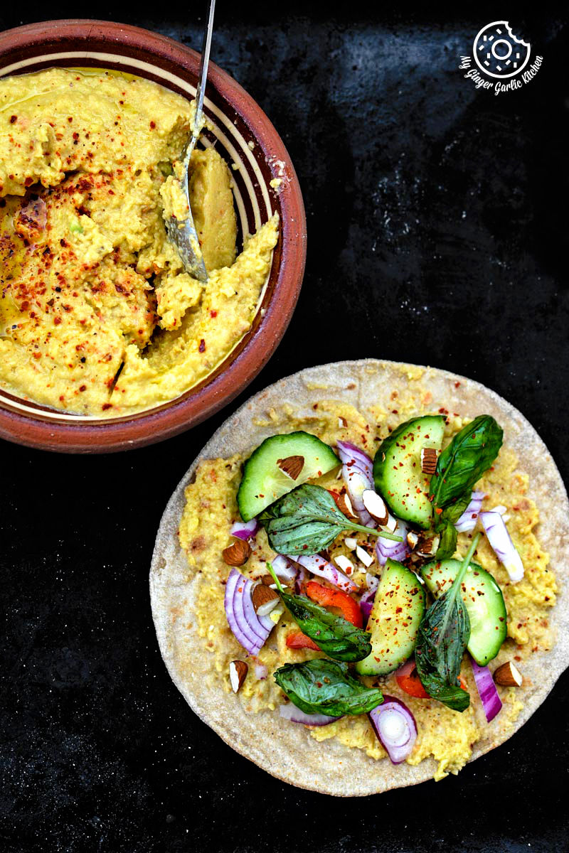 an indian chapati with peppery garlicky avocado spread and a side of garlicky avocado spread