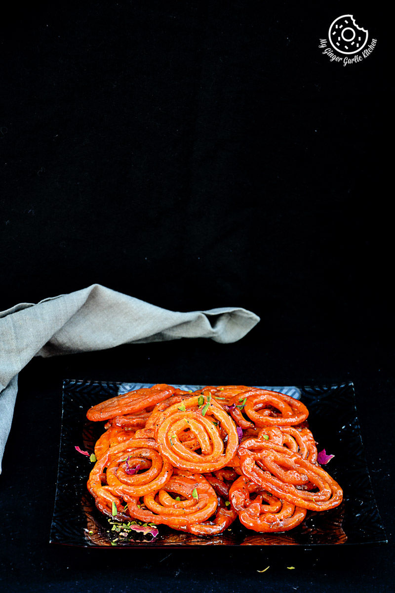 a plate of instant peach jalebis on a table