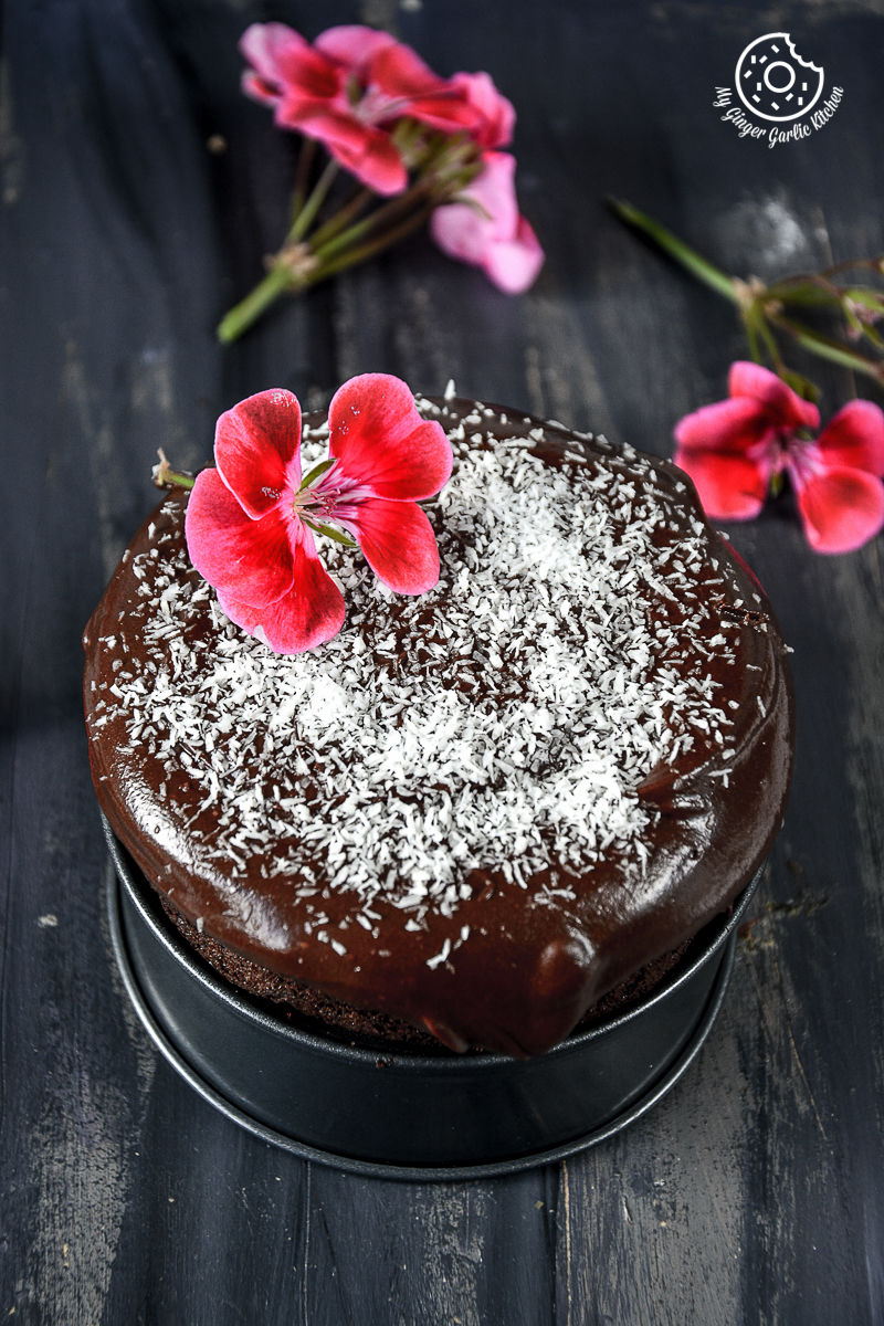 there is a chocolate beet cake with flowers on top of it