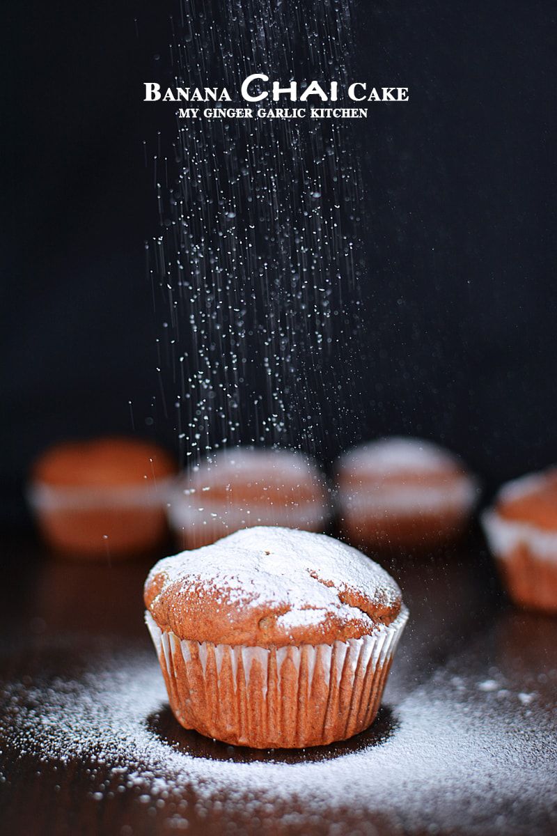 a dust of icing sugar sprinkling on a banana chai cupcake