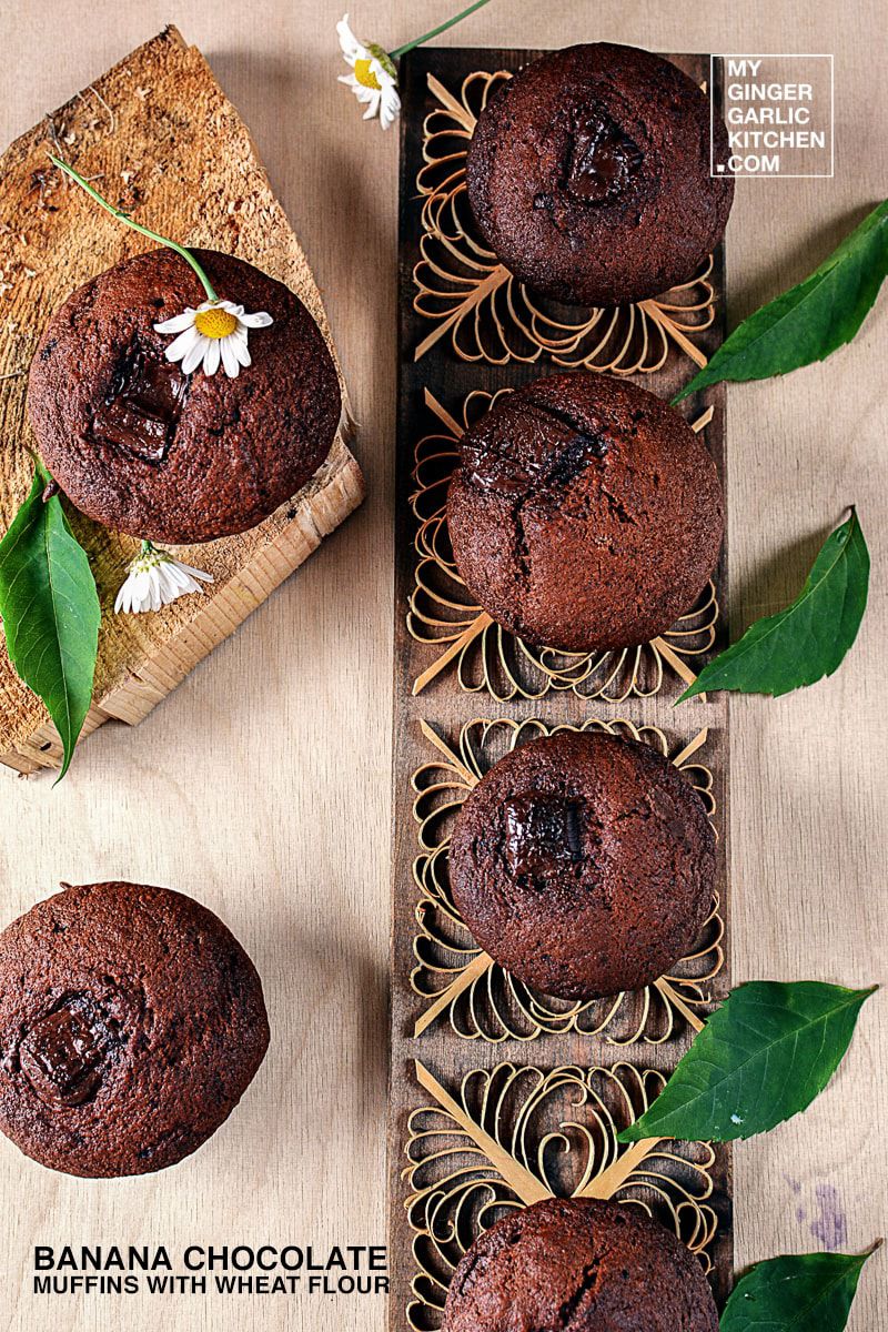 four banana chocolate muffins with wheat flour in a box with a flower