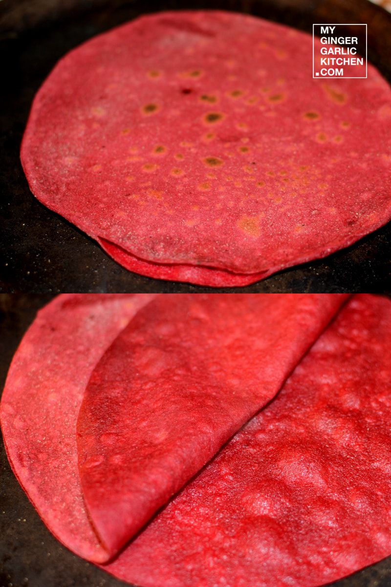 two red beetroot duppad rotis are being cooked in a pan on a stove