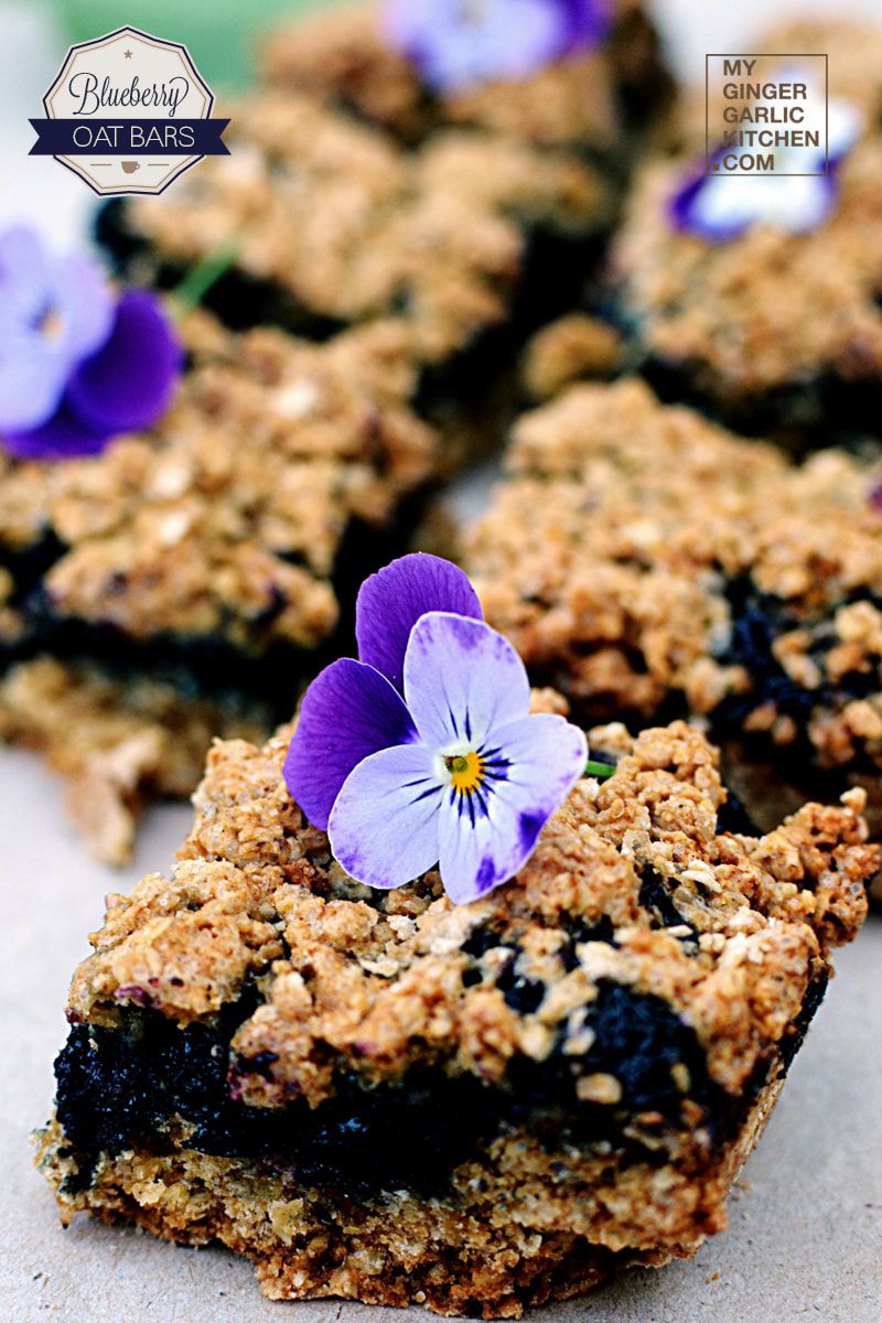 a few pieces of blueberry oat bars with a flower on top