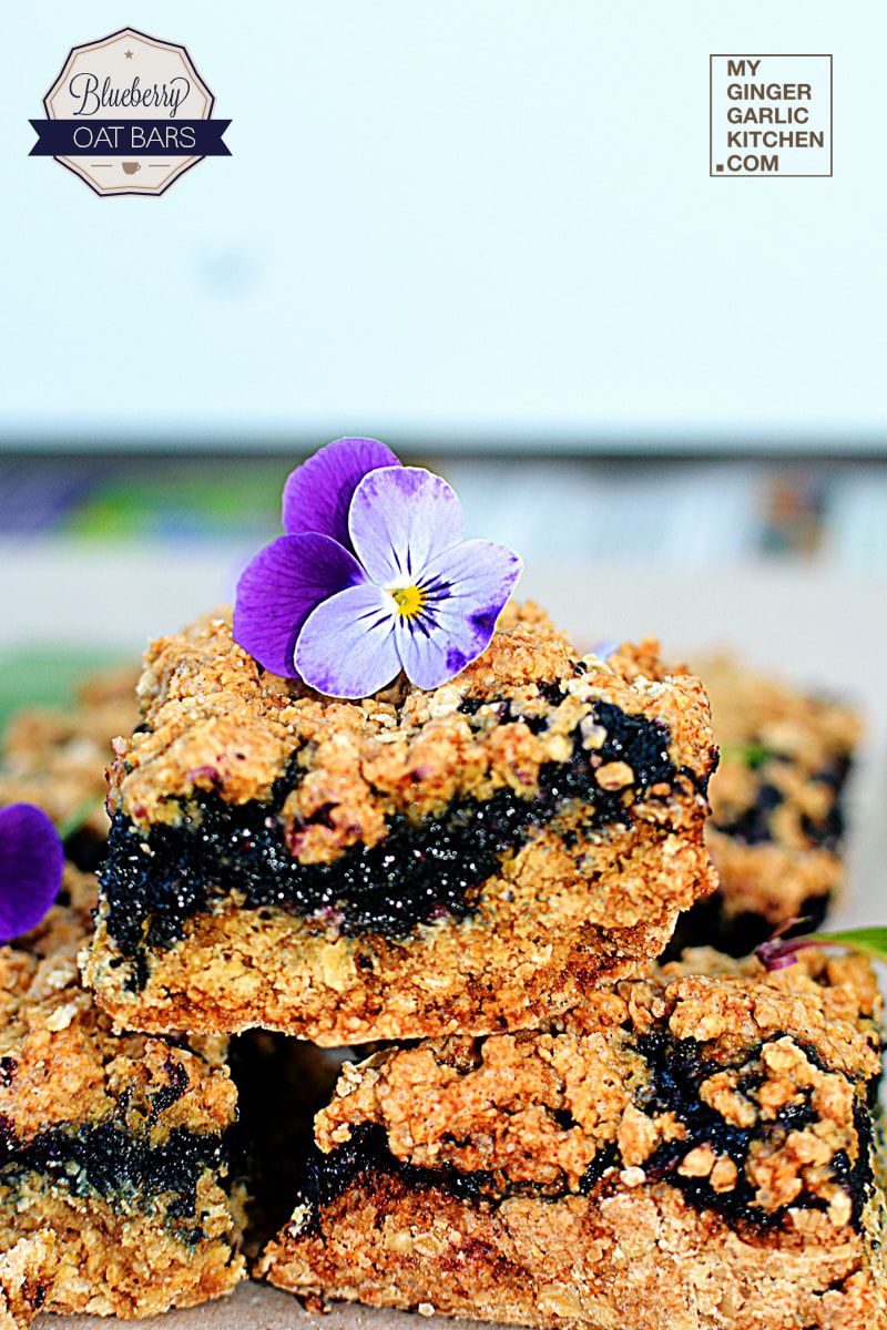 a few pieces of blueberry oatmeal bars stacked on top of each other