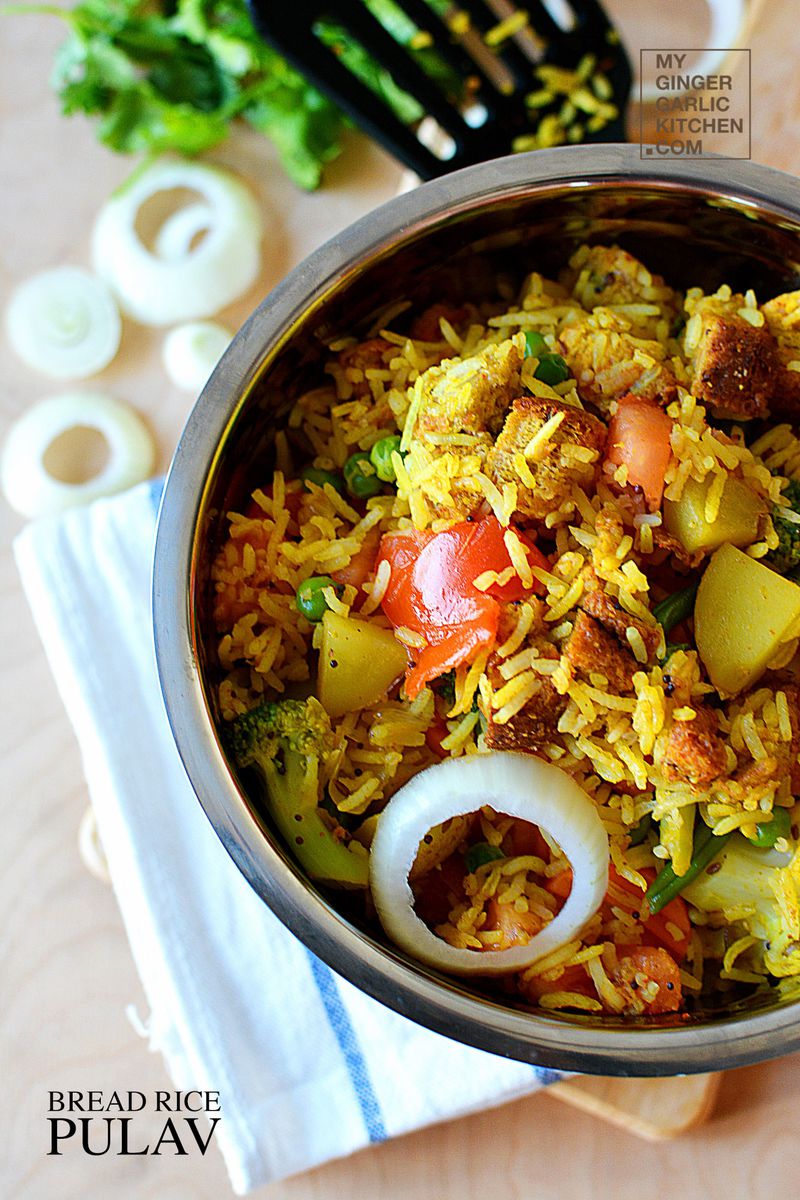 a bowl of bread rice pulao with onions and other vegetables