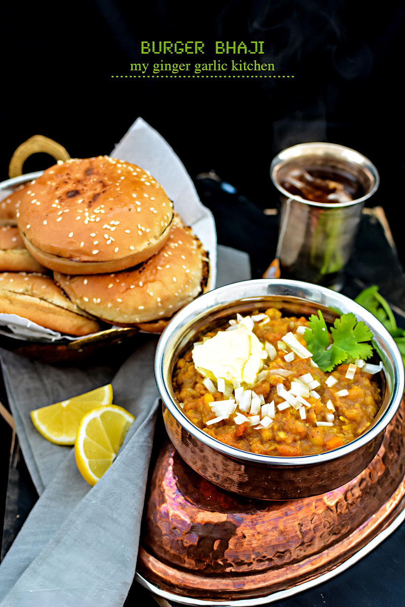 a bowl o bhaji and a plate of buger on a table