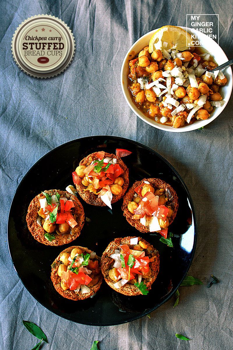 a plate of chickpea curry stuffed bread cups on a table with a bowl of chickpea curry