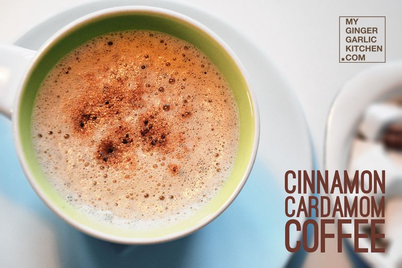 a cup of cinnamon cardamom coffee with cinnamon on top of it