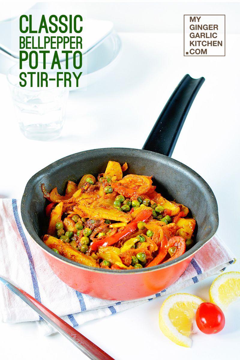 a pan with classic bell pepper potato peas stir fry in it on a table