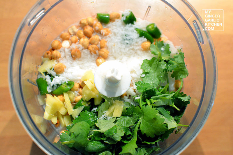 food in a food processor with coconut coriander chutney ingredients in it