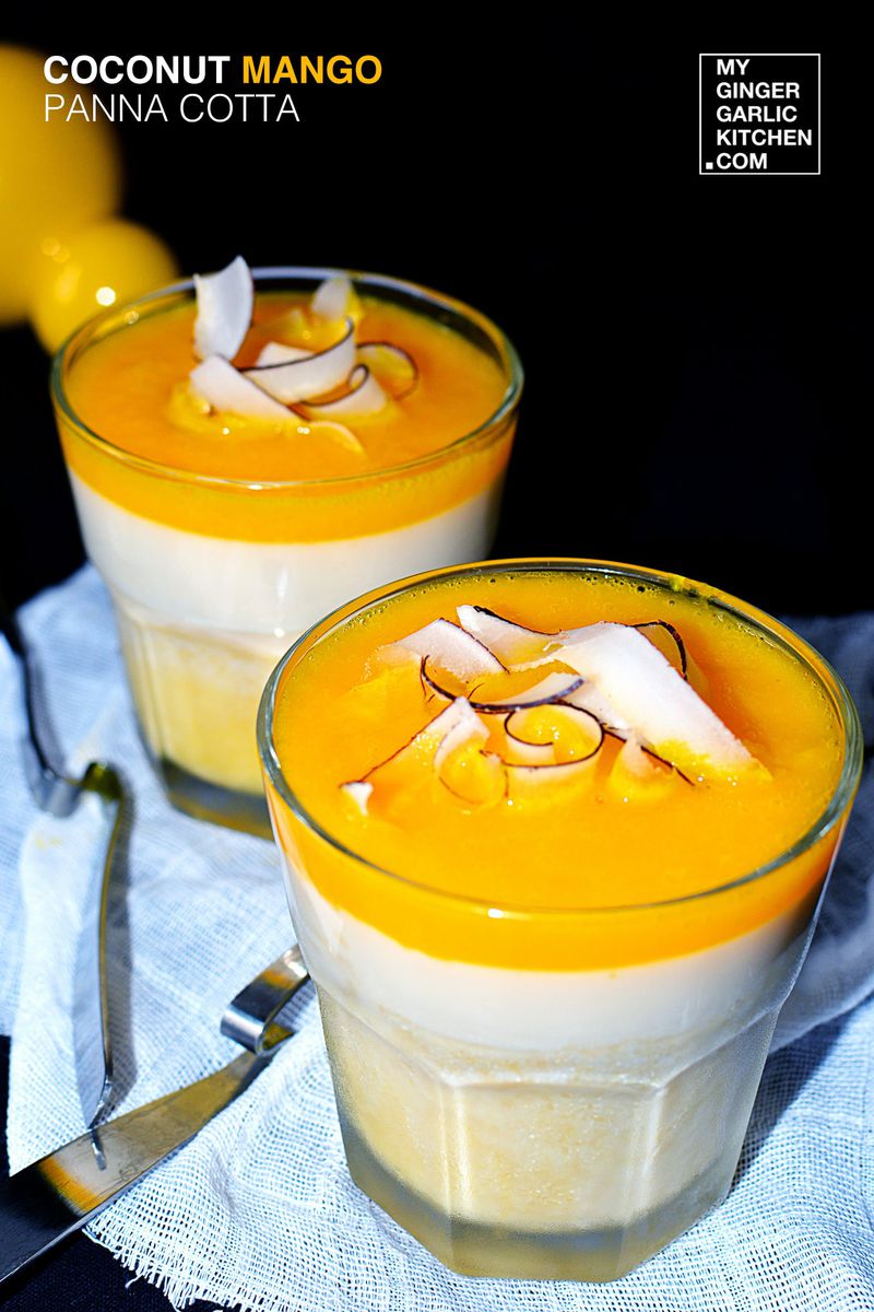 two glasses of coconut mango panna cotta with coconut slices on a napkin