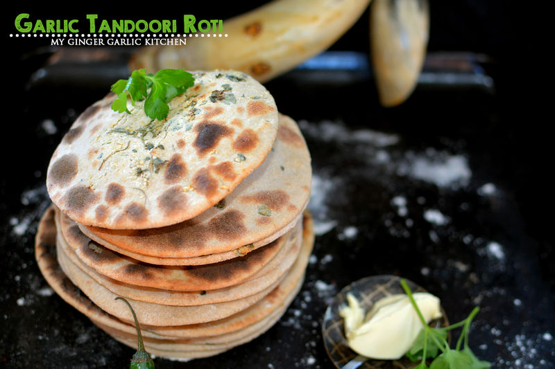 a lot of garlic tandoori roti stacked on top of each other