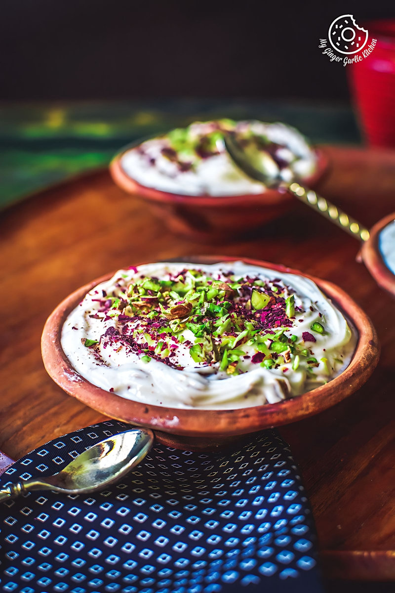 a bowl of gulkand shrikhand or rose shrikhand with one more bowl in background
