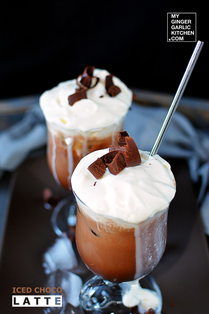 two glasses of iced choco latte with whipped cream and chocolate