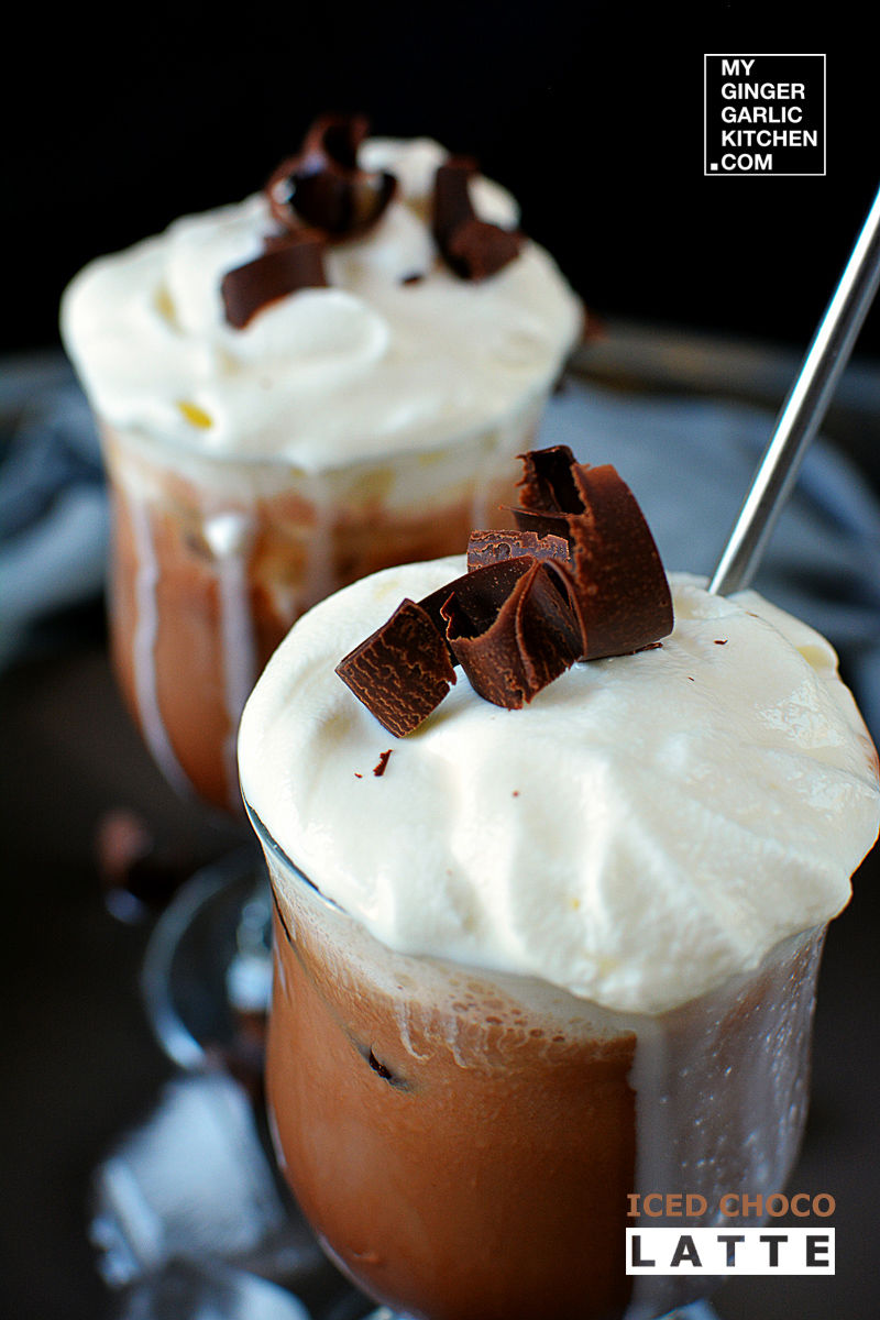 two cups of iced choco latte with whipped cream and chocolate