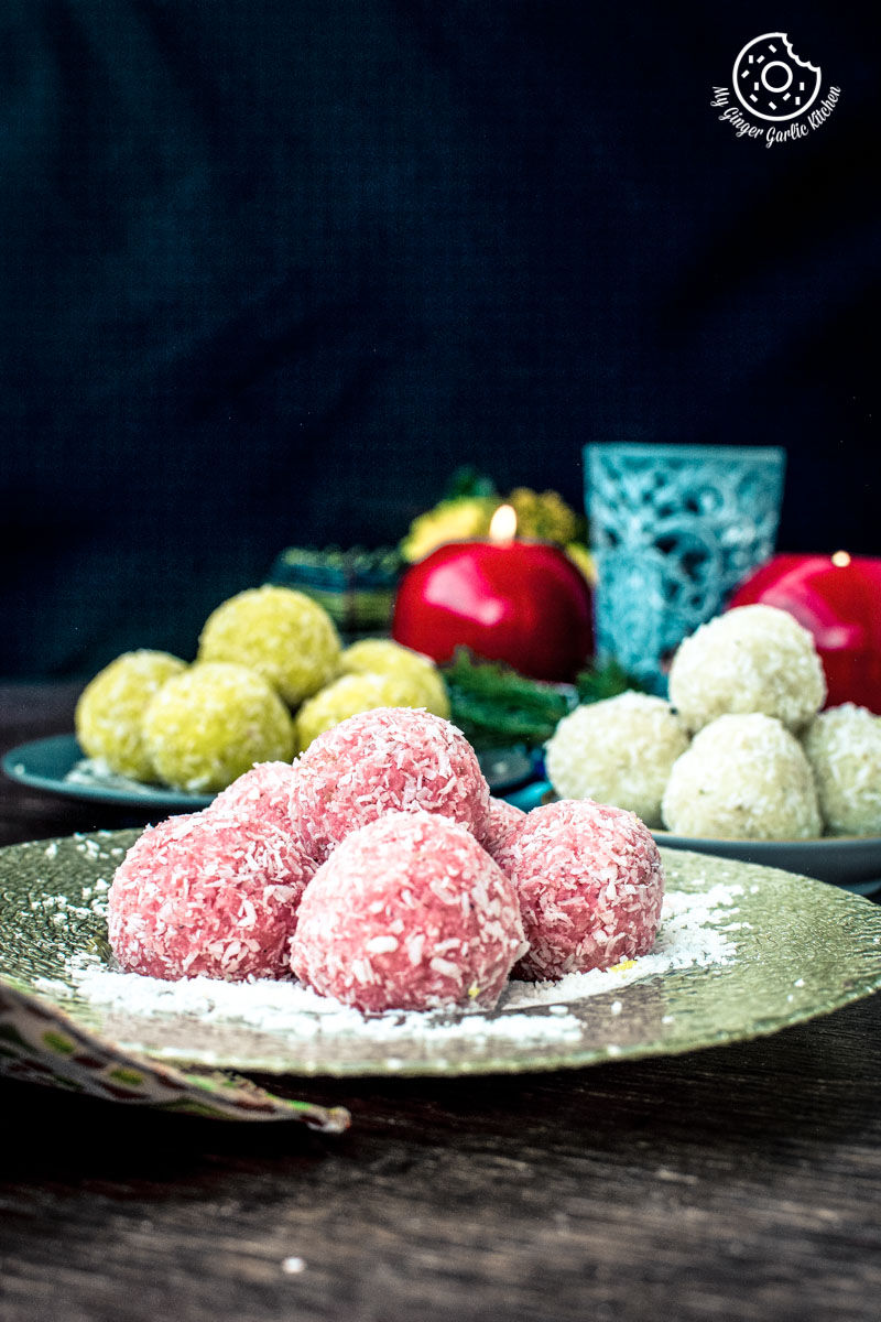 three plates of three types of instant coconut ladoos on a table with a glass