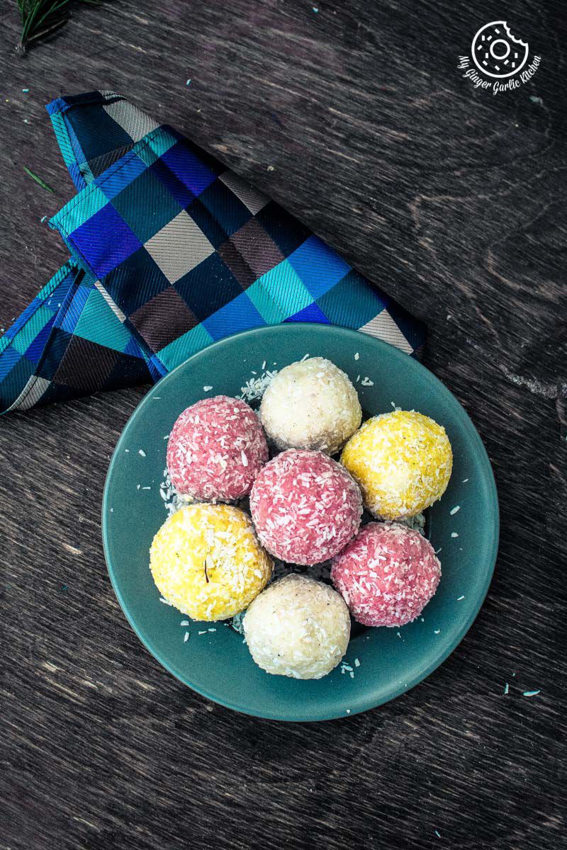 a plate of colorful instant coconut ladoos on a table
