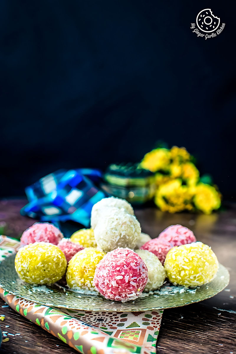a plate of colorful instant coconut ladoo on a table