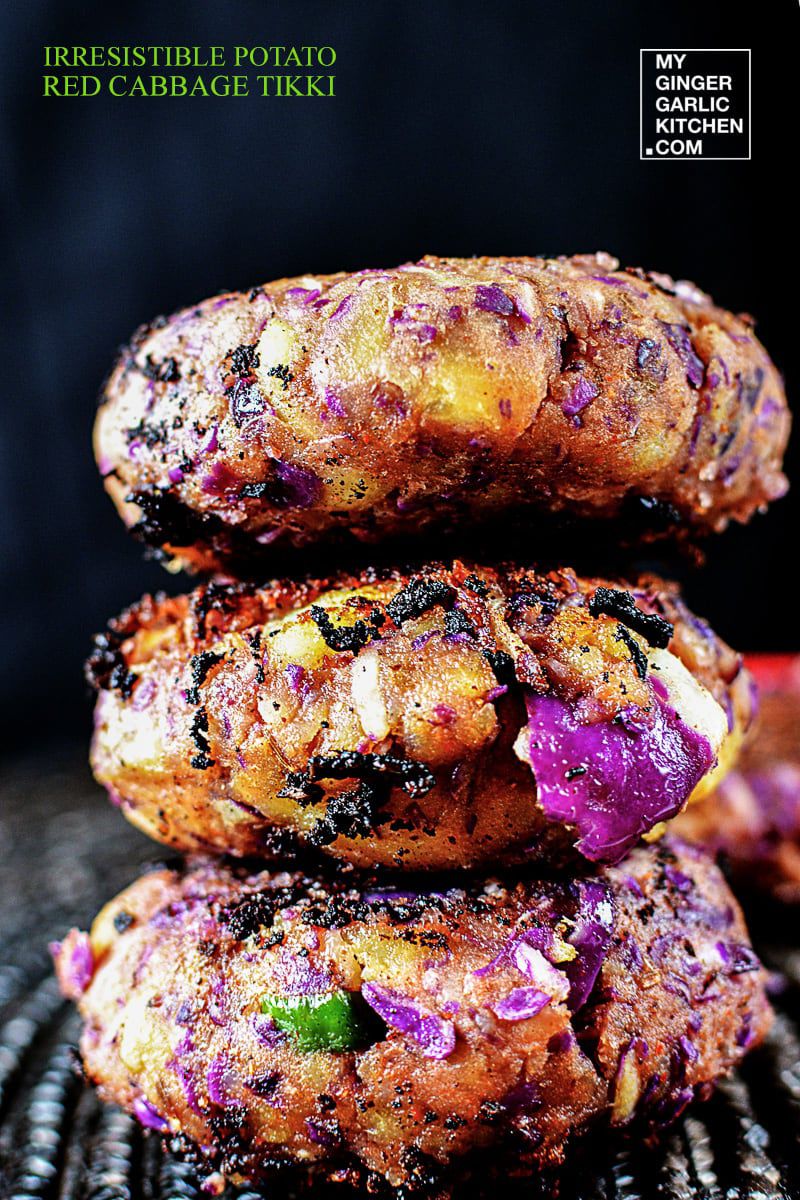 three potato red cabbage tikki stacked on top of each other on a mat