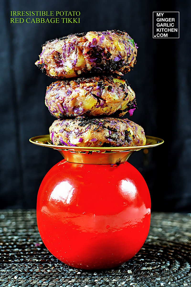 three potato red cabbage tikki stacked on top of a red ball