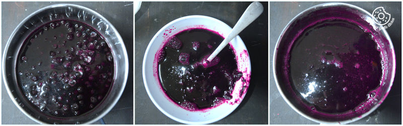 a close up of a bowl of blueberry sauce with a spoon