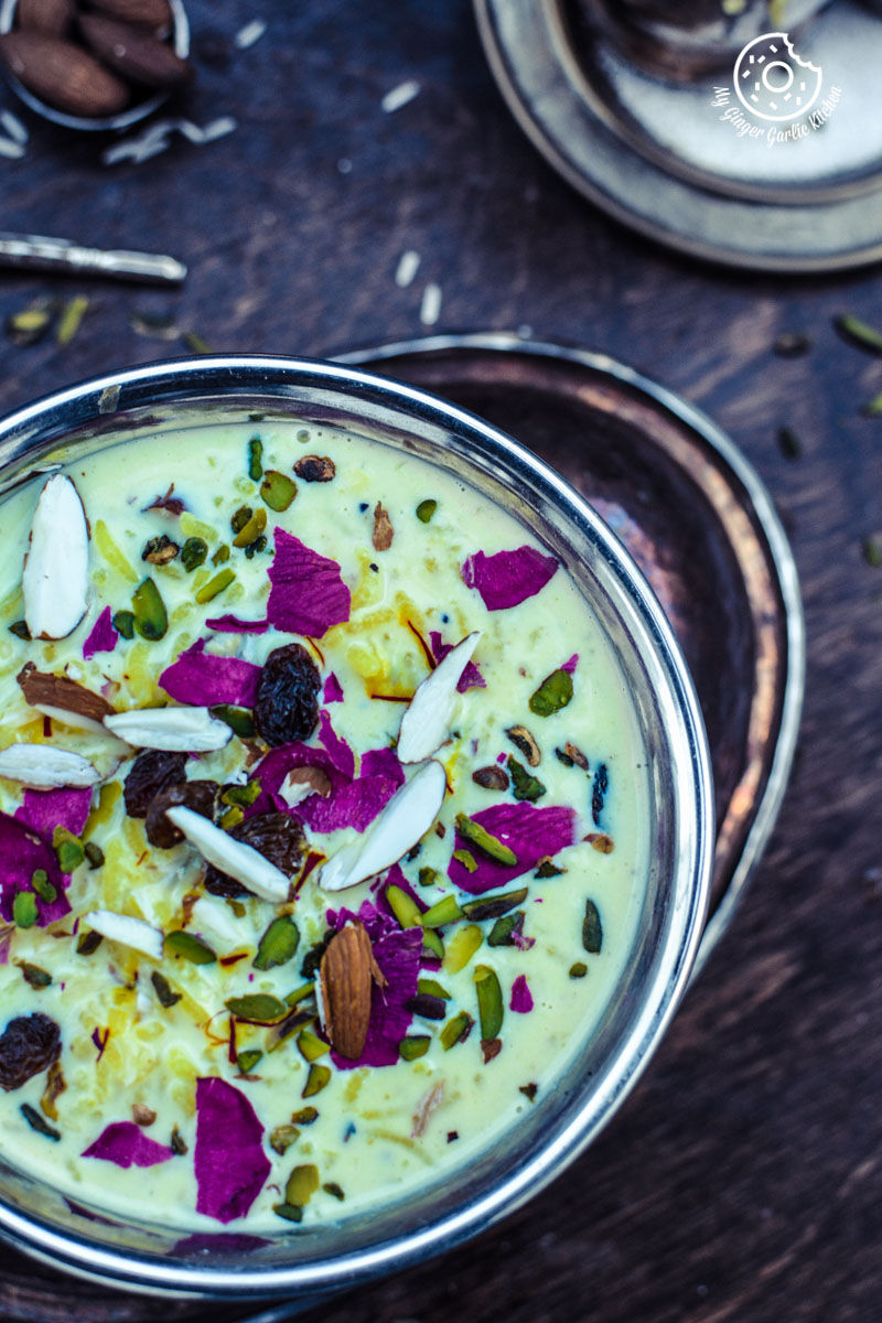 a bowl of kesari rice kheer with nuts and dried fruits on top