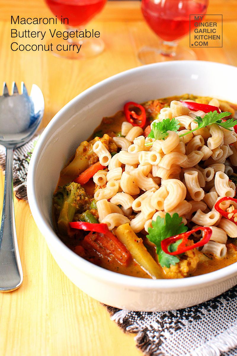a bowl of macaroni in buttery coconut vegetable in a sauce