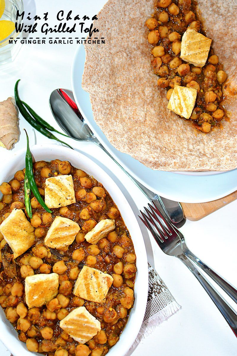 a bowl of mint chana with grilled tofu and a plate tortilla with chickpea with forks and spoons