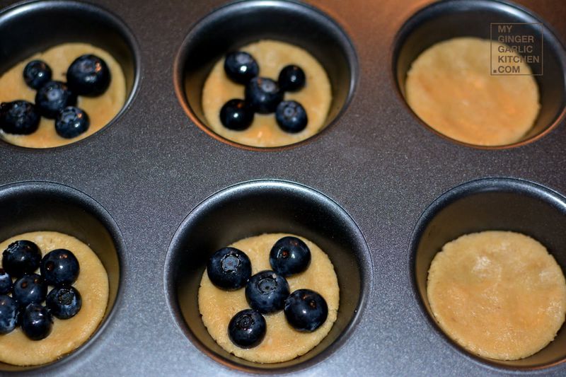 uncooked oat pie blueberry crust cookies a muffin pan with blueberries in them