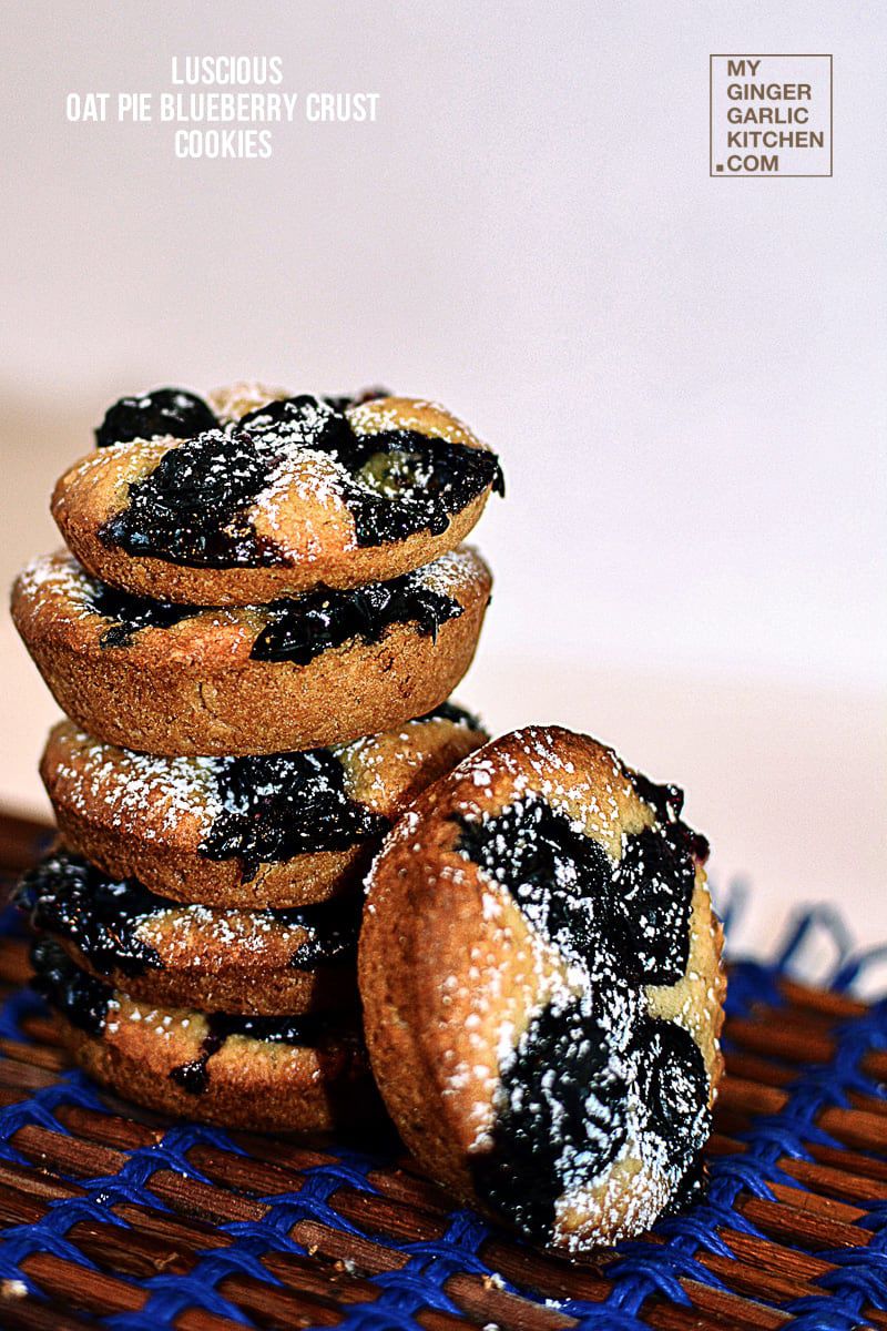 a bunch of oat pie blueberry crust cookies stacked on top of each other