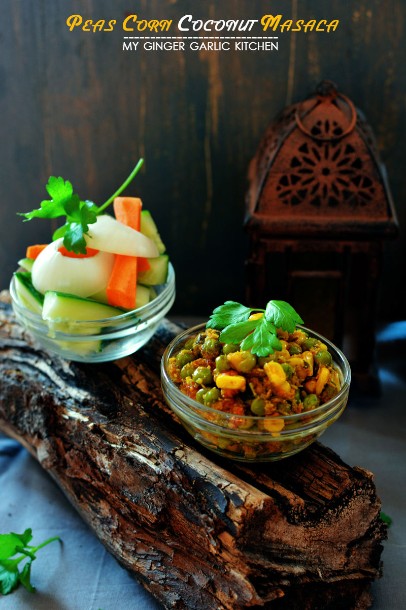 a bowl of peas corn coconut masala on a log with a wooden background