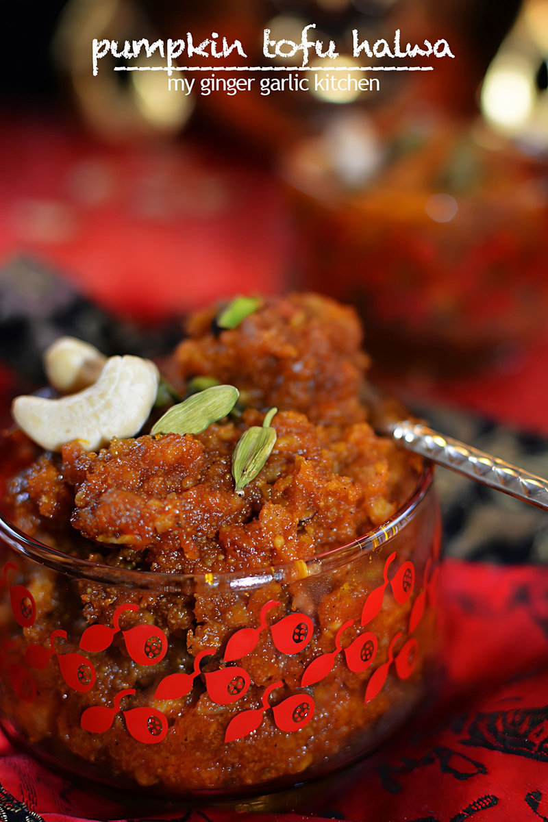 a small bowl of pumpkin tofu halwa with a spoon in it