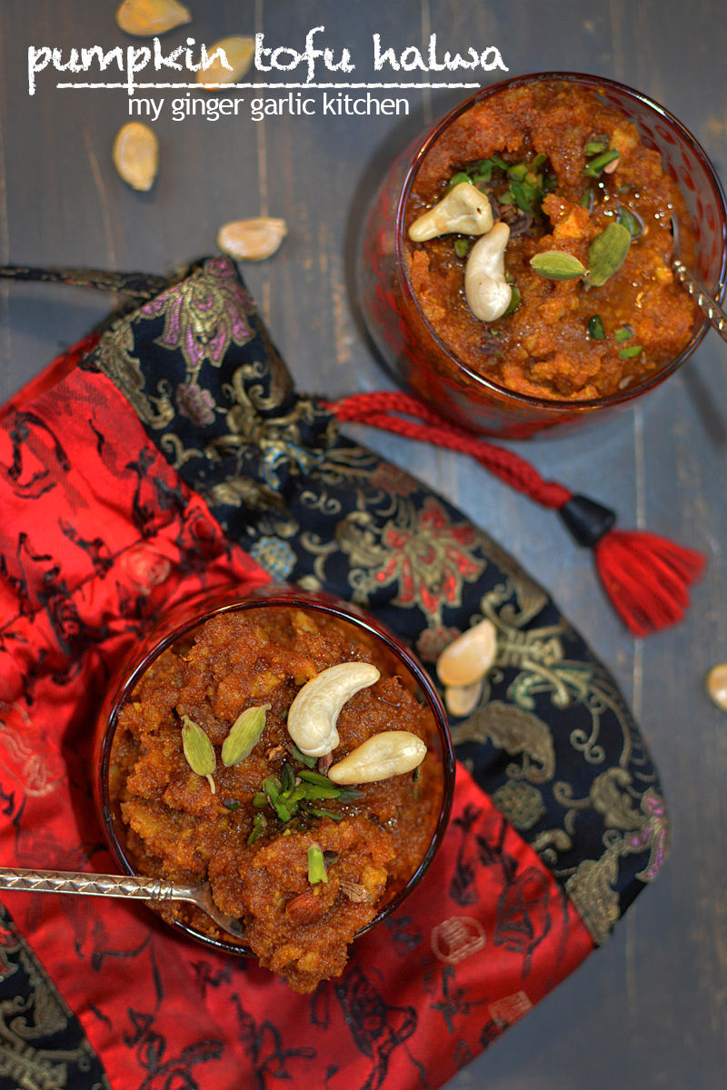 two bowls of pumpkin tofu halwa with nuts and a spoon